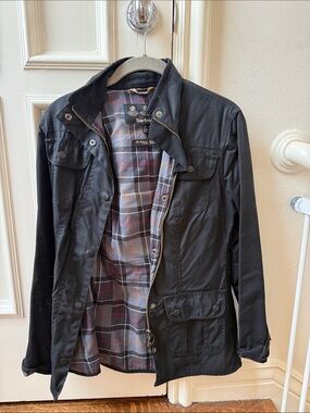 Barbour women’s Black Waxed Cotton Jacket with Plaid Lining